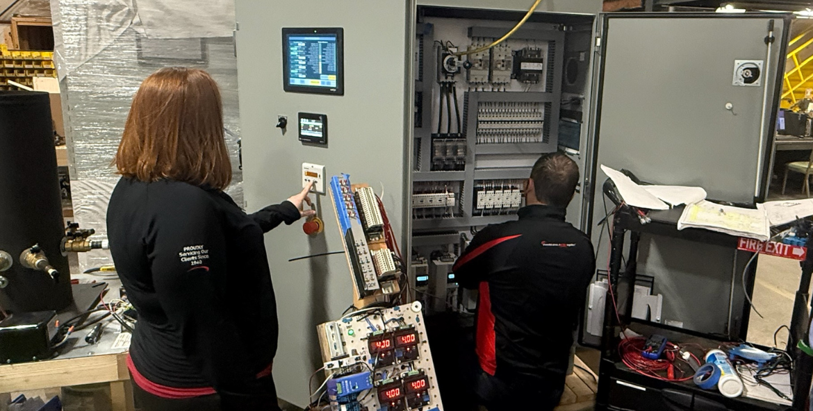 Engineering and Quality Control team conducting simulations for the final factory acceptance test.