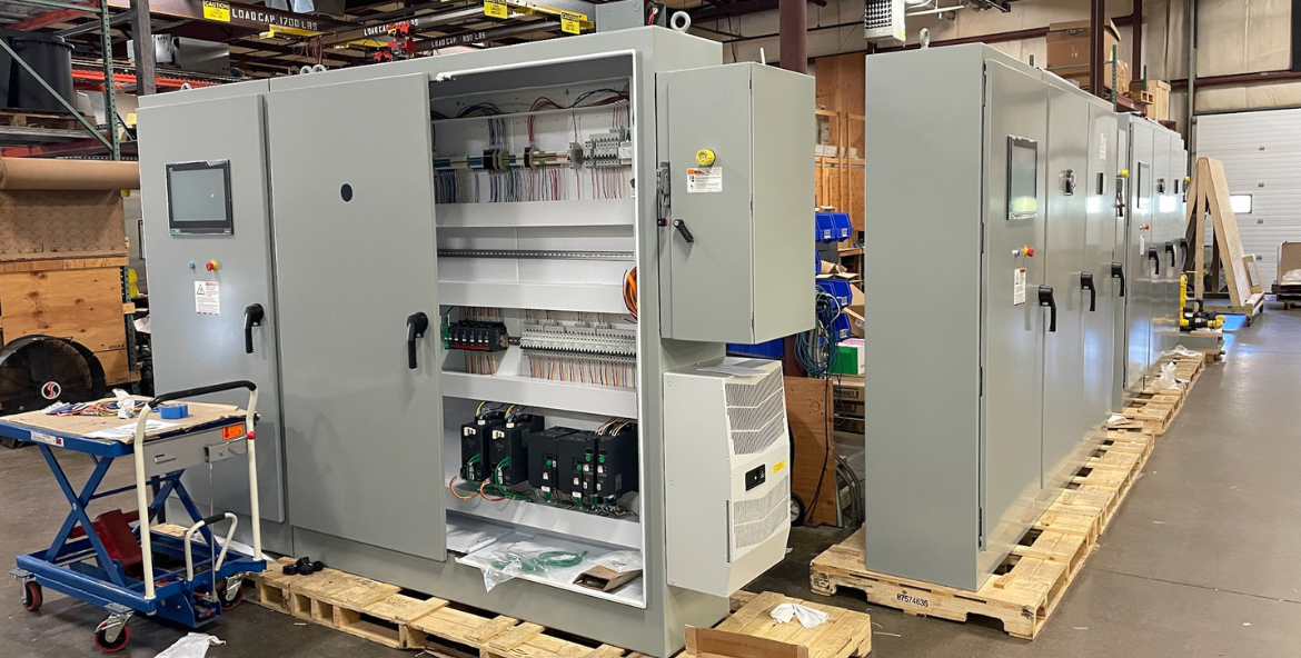 Three large multi-door control panels for a custom process extrusion line by ControlWorx.