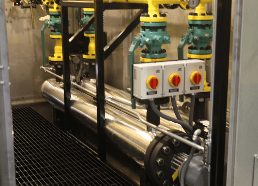 These photos are from a project done 2012 for a Pulp & Paper Mill in Maine (Verso Paper). This system was a Regulating Metering and Heater Station (RHMS) built in a steel transclosure to take 166,000 SCFH of 575 PSI Natural Gas off a transmission pipeline in Maine and knock it down to a delivered 40 PSI supply to Kiln Drying Process in the Mill. This system has multiple pressure cuts with pressure relief and explosion proof electric heaters to regain the temperature lost due to the significant pressure cut from 575 to 40 PSI.