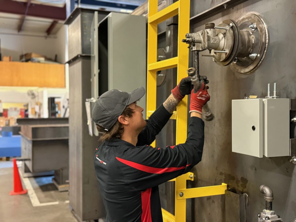Jeremy doing metal fabrication work